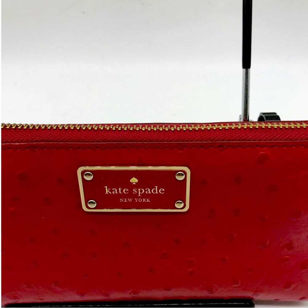 Kate spade ostrich red leather wallet, gold hardware and brass zipper
